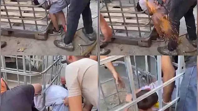 Çocuk demir parmaklıklara sıkıştı
