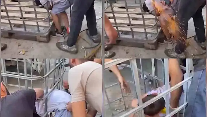 Çocuk demir parmaklıklara sıkıştı