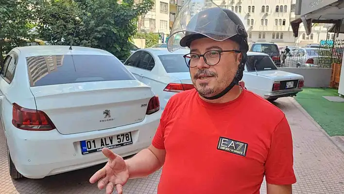 Otomobil kullanırken kask takmadığı için ceza yedi